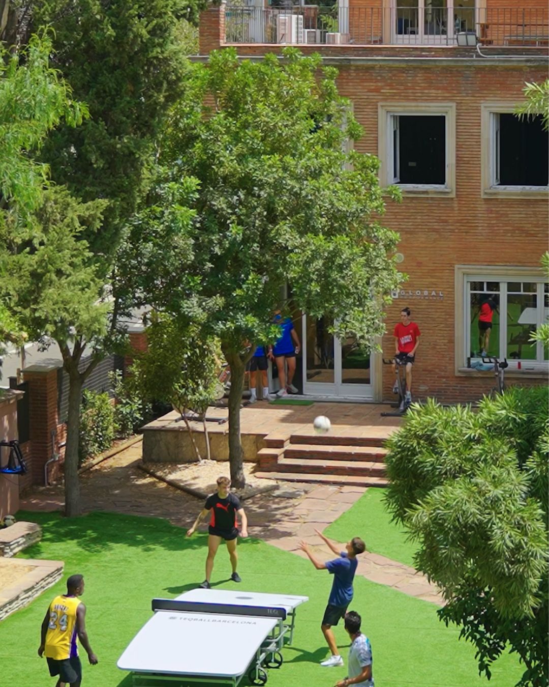 Athletes training in the outdoor turf garden at Global Performance Barcelona